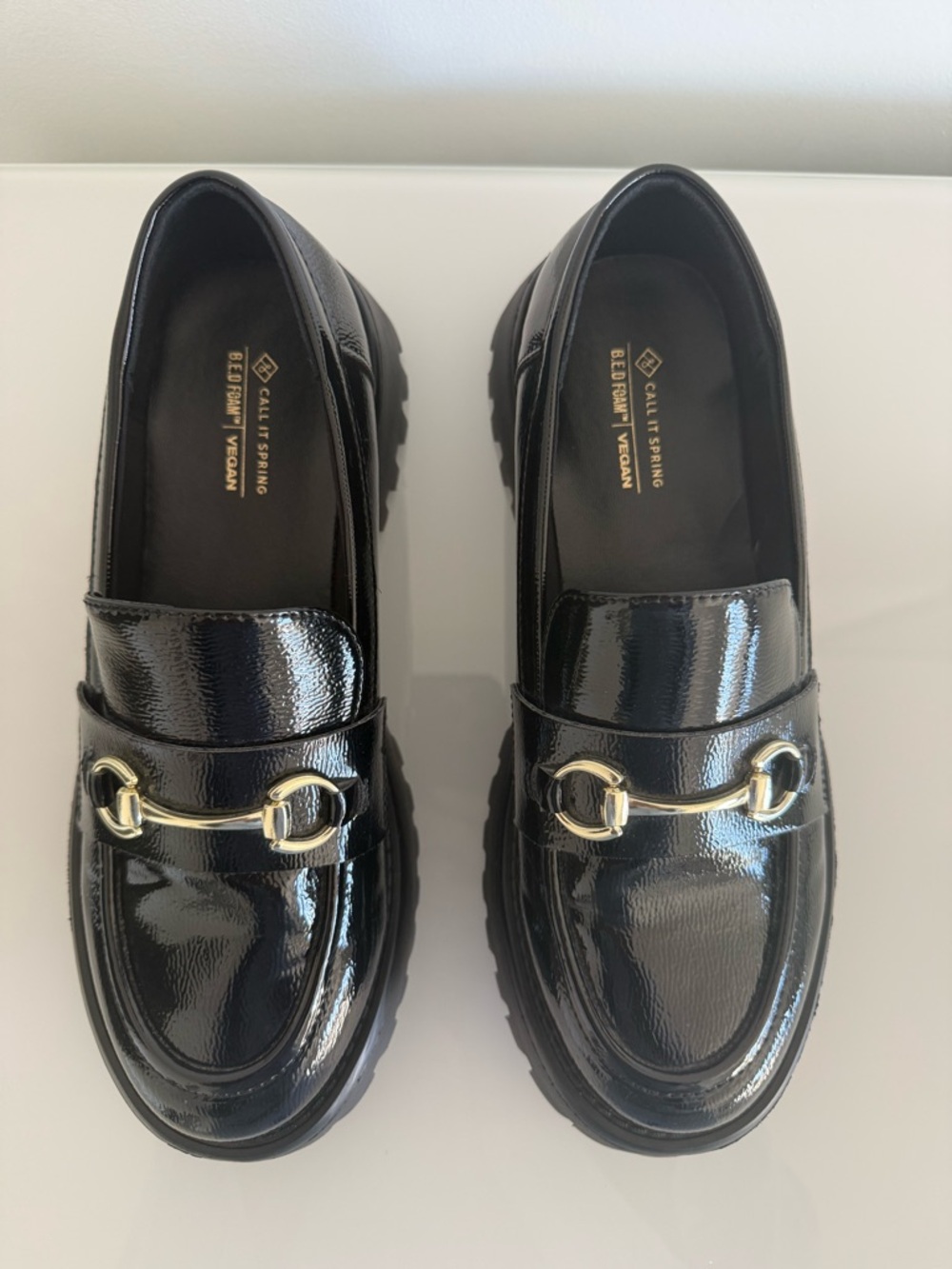 Black loafers with lug soles